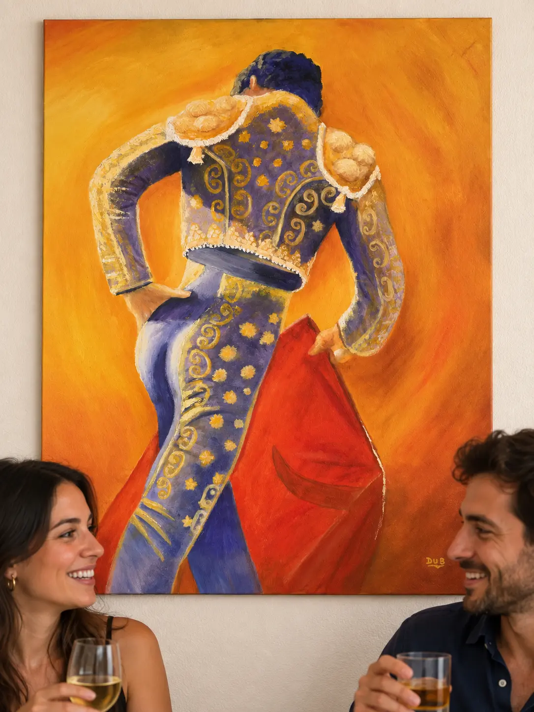 Tableau d’un matador en habit bleu et or avec une cape rouge